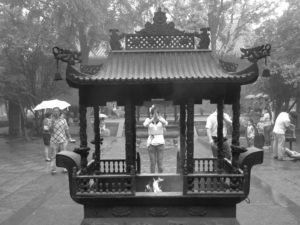 Praying and lighting incense at White Horse Temple