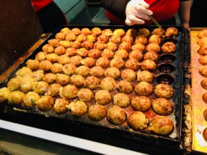 Takoyaki being cooked in Osaka