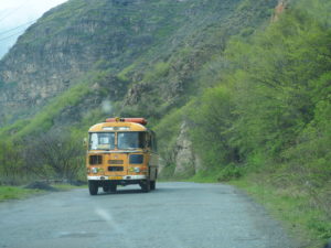 An old Soviet bus driving up to Sanahin