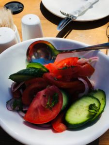 A traditional salad in Georgia - Tomato, Cucumber, Onion and Dill