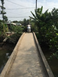 Bridges between the islets in Vinh Long are very narrow. Welcome to the Mekong Delta. 